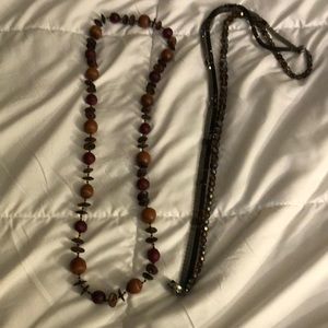 Both necklaces for $20. One is crystal and the other one is wood.